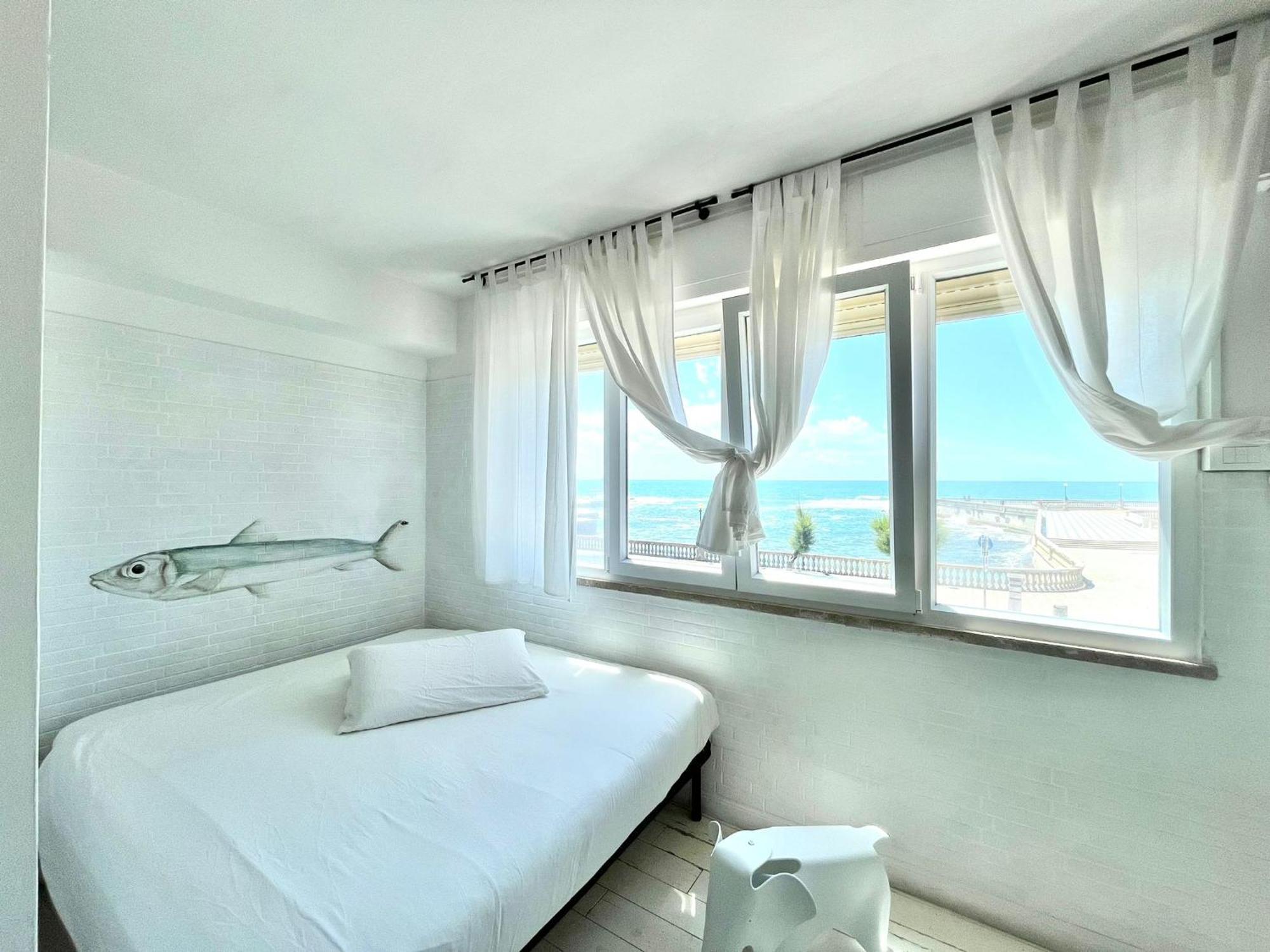 Апартаменты Sunset Loft Ливорно Номер фото